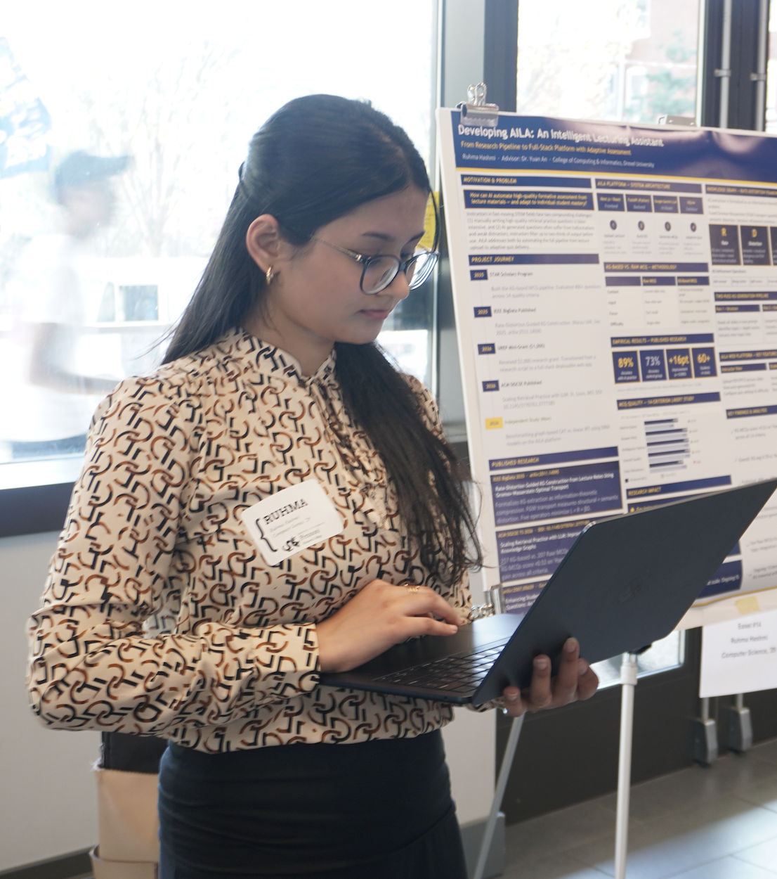 Ruhma Hashmi presenting AILA research at Drexel Student Showcase 2026